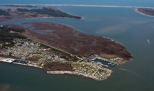 The southern end of Chincoteague Island in Chincoteague Bay. Assateague Island is visible in the background.