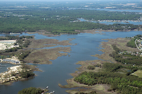 Herring and Turville Creeks in Isle of Wight Bay watershed. Herring Creek is on the right, and Turville Creek is at the top. The marina in the front left is under development at the Riddle Farm development.
