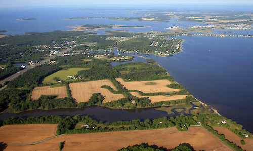 Looking west from Grasonville over Kent Narrows to Kent Island. The Kent Island bridge is visible. Eastern Bay is on the southern (left) side of Kent Narrows; the Chester River is on the northern (right) side.