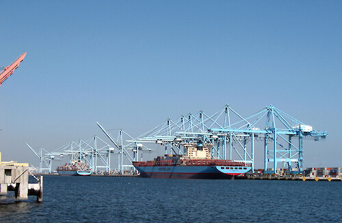 Cargo bardge and cranes at Los Angeles Harbor.