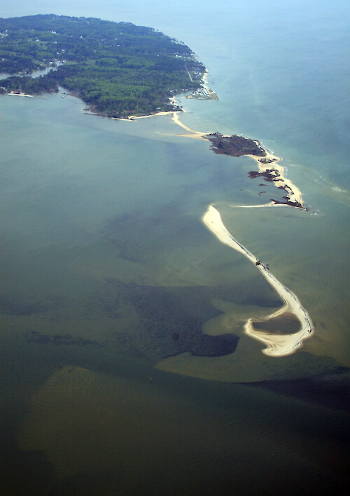 Looking northwest over Sandy Point on Gwynns Island, Virginia. Seagrass (submerged aquatic vegetation) is visible behind the sand shoals