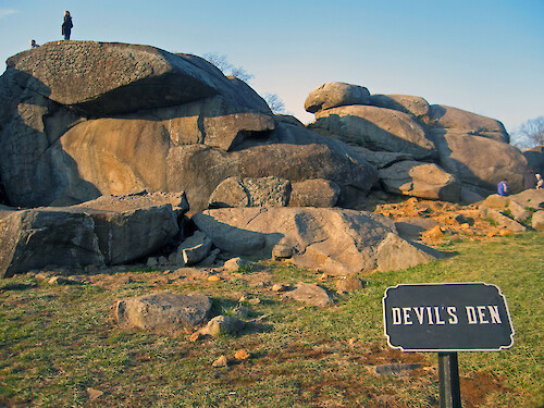 Devil's Den near Little Round Top, Gettysburg. This outcropping of massive igneous boulders was the site of fierce fighting on July 2, 1863, with a Confederate assault by Lt Gen James Longstreet's First Corps through this area. Conducted by the division of Maj. Gen. John Bell Hood, and including both the Texas Brigade and 3rd Arkansas, the charge was directed towards the left flank of the Union Army of the Potomac and hit Devil's Den as well as the high ground at Little Round Top. Devil's Den was defended by the Union III Corps division of Maj. Gen. David B. Birney, later reinforced by the V Corps.