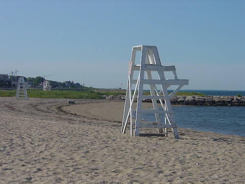 Empty lifeguard chair at the beach and jetties along Clarks Cove, Buzzards Bay, near New Bedford, MA. 