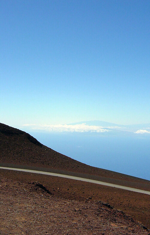 The road up the volcano Haleakala on Maui traverses an eerie barren landscape, some of which is above the cloudline