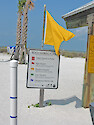 These flags are a system designed to warn beach visitors against strong currents and dangerous marine life