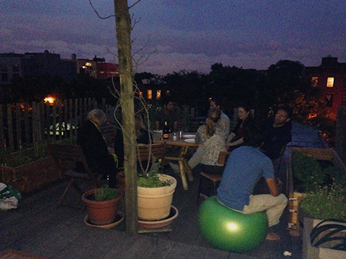 Brainstorming and relaxing at Sam Janis’ apartment in Brooklyn just after sunset. Credit: Judy O’Neil