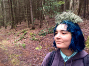 Claire Sbardella with a clump of moss on her head.