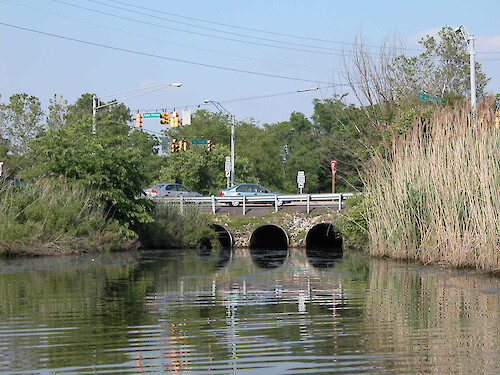 At the intersections of State Routes 322 and 33, three large stormwater culverts open to the headwaters of the North Fork of the Tred Avon River, Easton, MD.