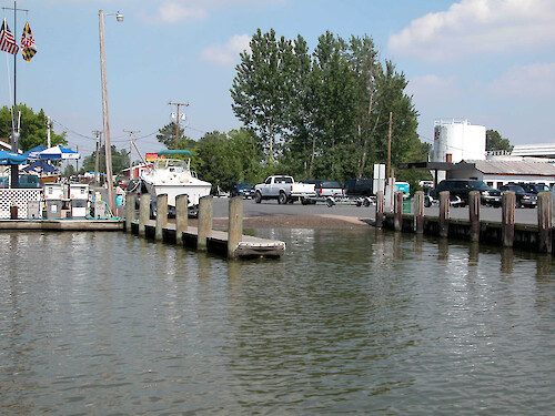 The Easton Point area has this public county boat launch and a commercial marina with waterfront fuel sales. Stormwater river input from the parking lot is unopposed, and the fuel pumps can often be seen standing half submerged in high water events. The likelihood of diesel and gas fuel spills and stormwater runoff pollution is significant.
May 2005, Tred Avon River, Easton, MD