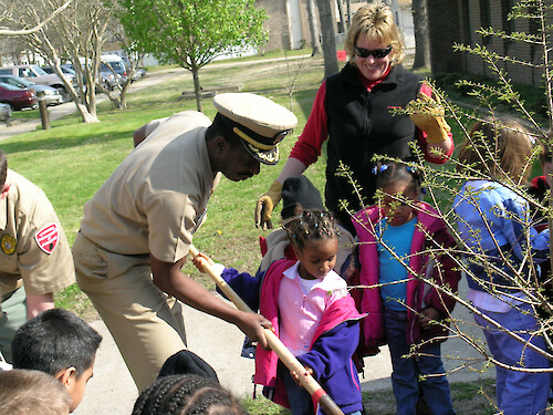 Navy volunteers from Naval Amphibious Base, Little Creek, VA participate in tree plantings with local school children as part of continuing education and outreach.