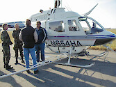 DoD personnel discuss procedures for aerial application of herbicides to control the common reed (Phragmites Australis)