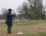 DoD Scientist sampling golf course soils prior to application of fertilizer
