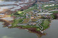 Golf course located in Assawoman Bay, adjacent to the Isle of Wight Wildlife Management Area. Also visible in the background are ditches and eroding marshes.