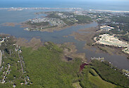 Aerial view of Herring (background) and Turville (foreground) Creeks. The Riddle Farm development is visible on the right. Cape Isle of Wight and Assateague and Fenwick Islands are in the background