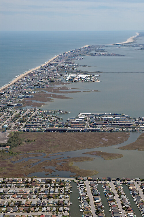 Looking south along Fenwick Island - the eastern margins of Assawoman Bay and Isle of Wight Bay. The Route 90 bridge is visible, and Ocean City and Assateague Island are visible in the background.