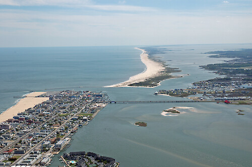 Aerial view of the Ocean City Inlet from Isle of Wight Bay. Also visible are Assateague Island and Sinepuxent Bay, and the Route 50 bridge.