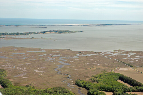 Looking west across the mouth of Newport Bay. The southern end of Sinepuxent Bay, the northern end of Chincoteague Bay, and Assateague Island are visible in the background.
