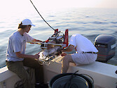 Tom Wazniak and Lora Pride preparing the Acrobat 2 during the PAX ACE-INC cruise in Feb 2001. The towed underwater instrument measures temperature and salinity.