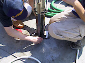 Larry Sandford and Pat (...)hudt collecting a sediment core on the PAX ACE-INC (Atlantic Coast Environmental Indicators Consortium) cruise on the R/V Aquarius in February 2001