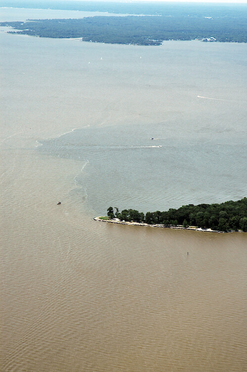 Sediment plume coming out of the South River after the torrential rains of June and July 2006. Thomas Point is in the foreground.