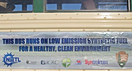 'This bus runs on low emission synthetic fuel for a healthy, clean environment'. This is one of the tour buses operating in Denali National Park