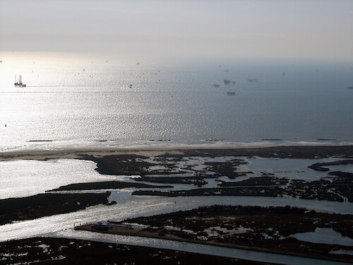 Aerial photo of coastal oil fields of Louisiana over eroding marshes 