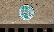 These signs on stormwater drains remind people that water flowing into these grates drains into Chesapeake Bay