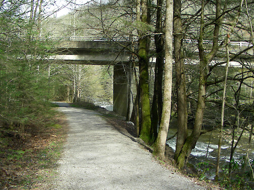 highway overpass, mountain trail and creek in national park