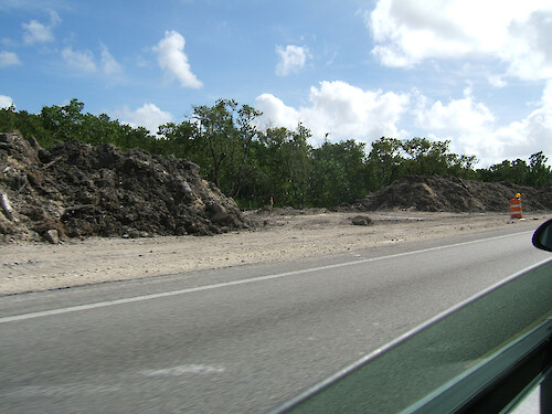 Piles of sediment related to the construction involved with the widening of Route 1 on the way to the Florida Keys.