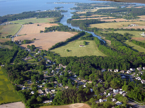 Mix of farming and urban development on Kent Island, Eastern Shore, Chesapeake Bay. The farming is surrounded by a forest buffer.