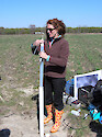 Demonstrating how to take water quality measurements in a field in Maryland.