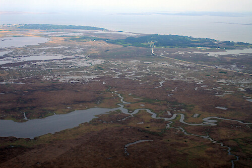Looking across the Deal Island Wildlife Management Area towards Deal Island and Chance. Broad Creek is in the foreground. Route 363 is also visible
