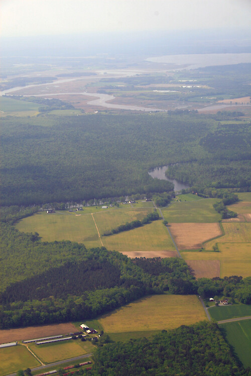 Forests and fields surround the Pocomoke River as it makes its way to the Chesapeake Bay. Here it forms the border between Worcester and Somerset Counties