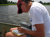 Recording water quality measurements from a YSI sonde while monitoring in Monie Creek, part of the Monie Bay National Estuarine Research Reserve. 