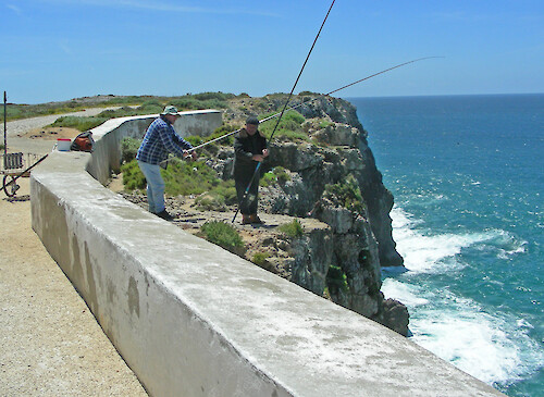 Surf fisherman overlooking the ocean waters near Cape Saint Vincent in SW Portugal - most westerly point in Europe.
