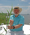 UMCES-HPL scientist J. Court Stevenson holds up a native north american phragmites. This is opposed to the invasive Phragmite australis subsp. australis. Found on the bank of the Choptank River in Maryland.