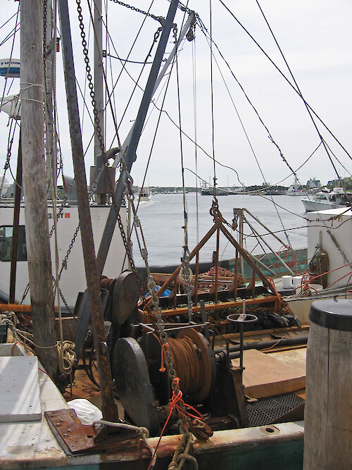 The differrent booms and dredging mechanics of a Scallop boat, in Montauk Harbor, NY