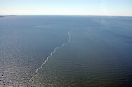 Sediment plumes in the Chesapeake Bay near the Bay Bridge.