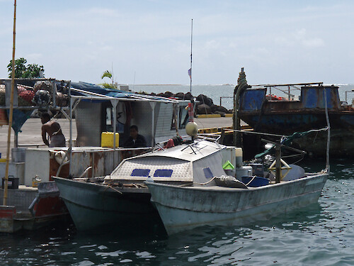 A typical double-hulled fishing boat, used for offshore fishing. Currently moored outside the fish market in Apia, Samoa.