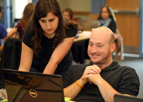 Science communicator, Alexandra Fries, assisting a participant at the science communication course held at Horn Point Laboratory, Cambridge MD in May 2013.