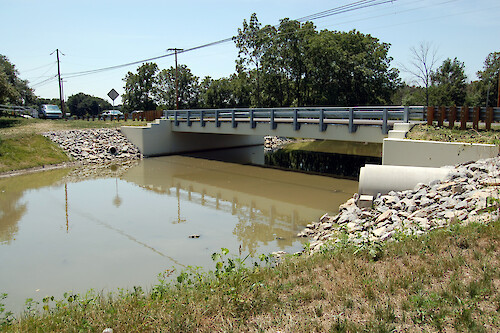 A section of Pipe Creek was widened and the bridge crossing it expanded to reduce sediment erosion from the streambanks. Sandusky, Ohio.