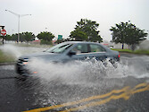 Car driving through flooding waters in Maryland.