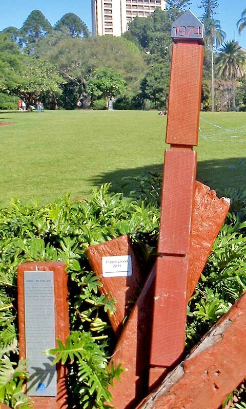 The 1974 flood marker with the 2011 marker recently added in the Botanic Gardens.