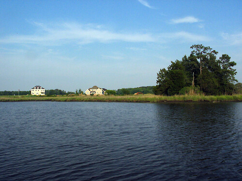 Residential development and forest in proximity to Monie Creek, a tributary of Monie Bay, a sub-estuary of Chesapeake Bay