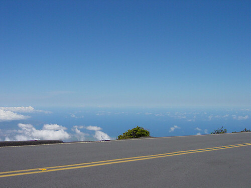 The road leading up the Haleakala volcano heads higher than some clouds.