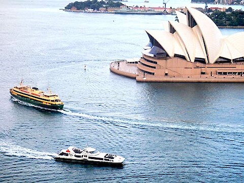 Sydney ferries in front of Sydney Opera House.