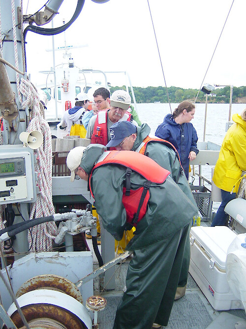 Readying and checking research equipment on the Aquarius during a cruise along the Patuxent River 