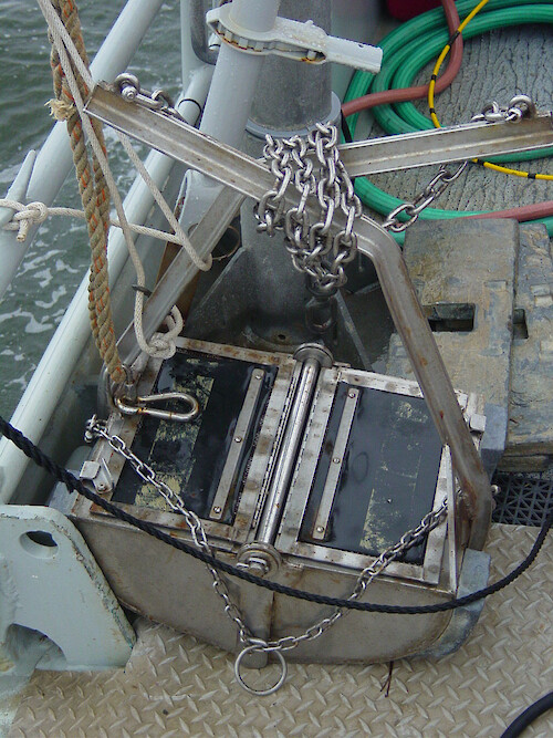 This sediment grab remains open when sent to the bottom and the release snaps shut the mouth for sediment collection. 