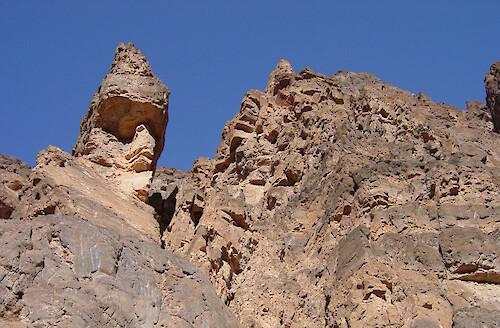 This precipitous rock structure is found along Titus Canyon. Death Valley has quite a variety of topography and geologic formations.