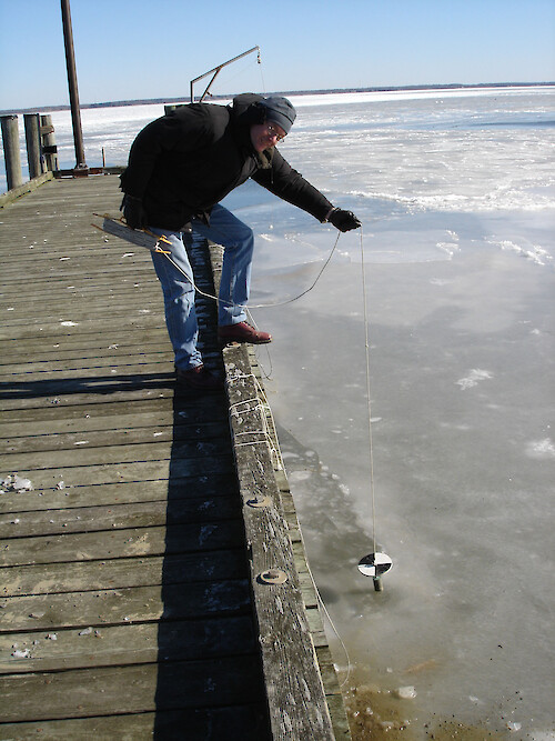 Measuring Secchi depth in winter presents a challenge. 
